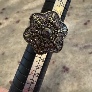 Heidi Daus crystal pave ring with lavender stones.